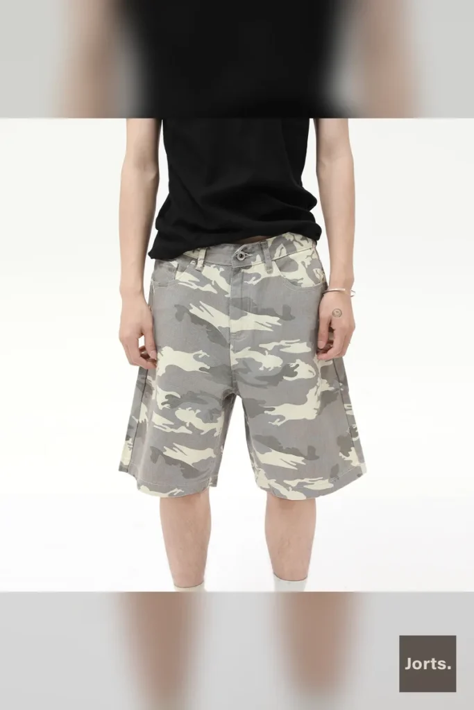 Back view of men's dark camouflage baggy denim jorts, highlighting the loose fit and Y2K aesthetic.