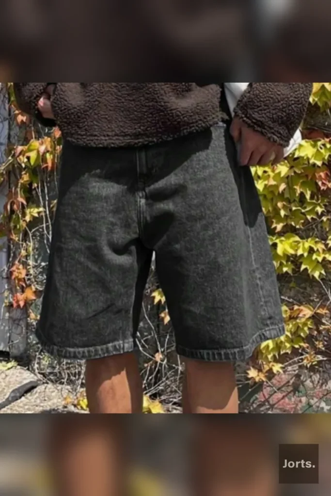 Mens Black Wide Leg Cropped Jorts styled for a Y2K streetwear outfit, perfect for a nostalgic look.