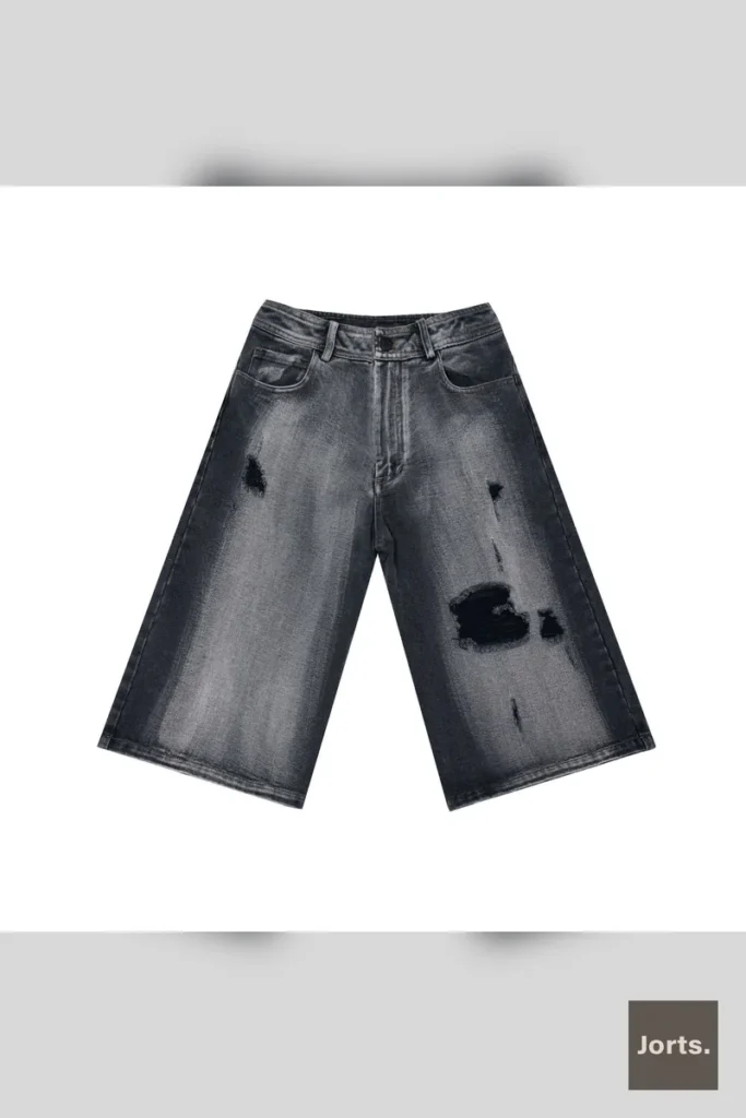 Back view of mens distressed black denim jorts, highlighting the straight-leg cut.