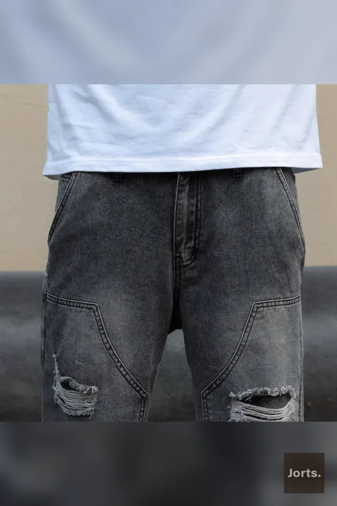 Back view of mens gray straight-leg denim jorts, showing pocket detail and overall relaxed fit from behind.