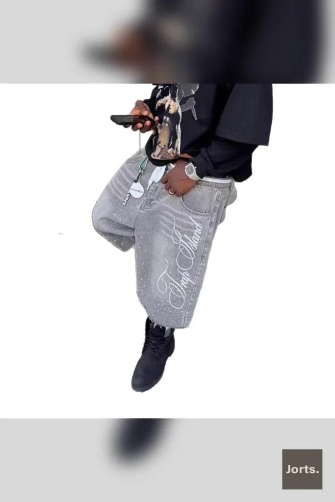 Mid-rise waist detail of men's retro baggy denim shorts