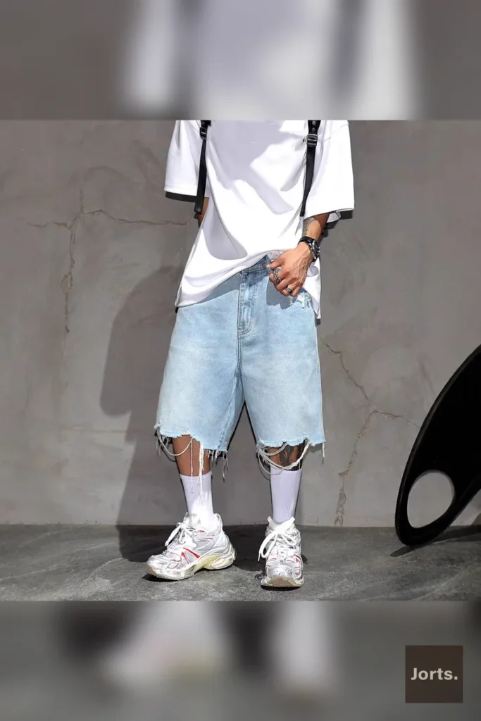 Model wearing men's straight-leg denim jeans in a casual pose, highlighting the relaxed fit.