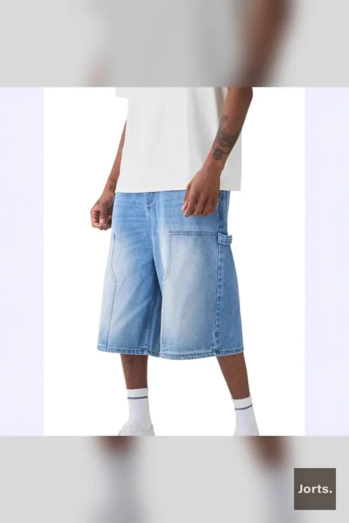 Men's Y2K baggy straight-leg denim jorts in blue, front view, styled for streetwear.