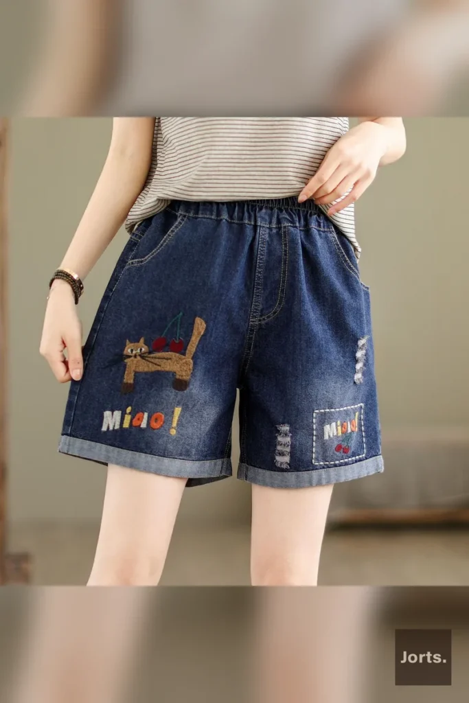 Little Girl graphic on plus-size wide-leg denim shorts, a sweet nostalgic touch
