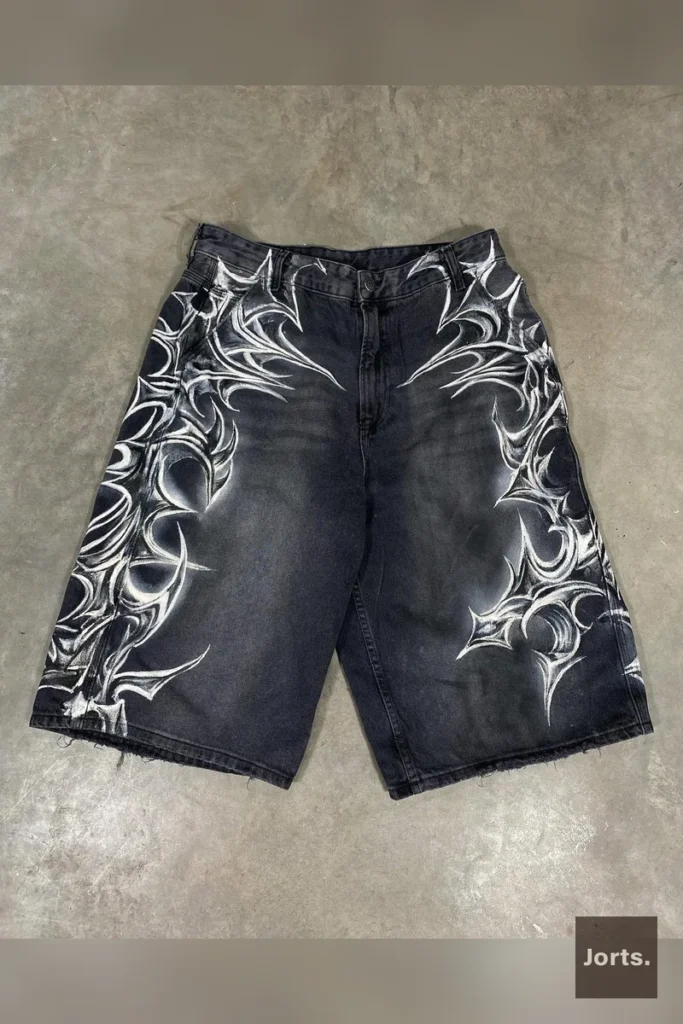 Model wearing Jorts Retro Baggy Printed Graphic Cropped Denim Jorts, front view showcasing the unique graphic print and loose fit.