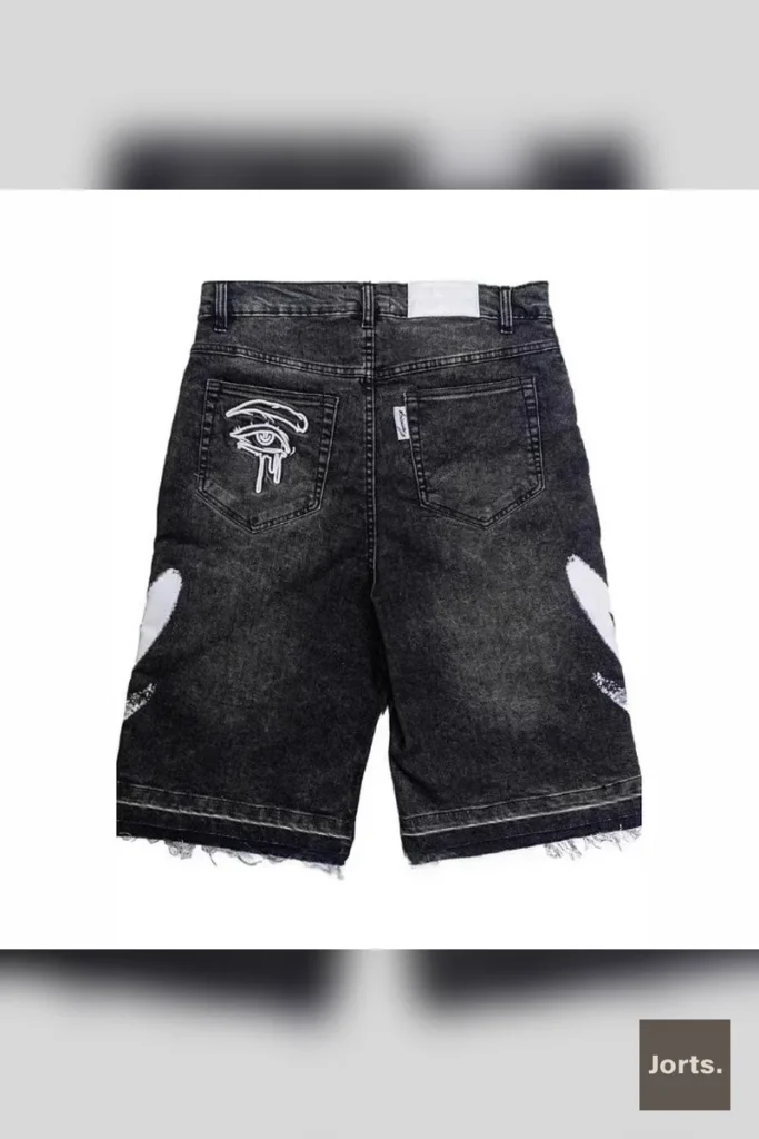 Model wearing black retro straight-leg loose fit shorts, showcasing the relaxed Y2K streetwear style.