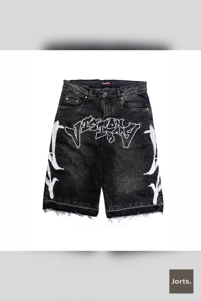 Side view of black retro straight-leg loose fit shorts, highlighting the relaxed silhouette and sporty cut.