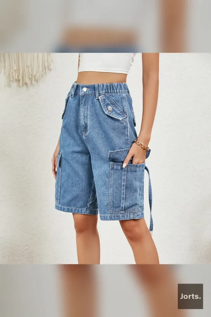 Front view of women's washed distressed blue denim cargo shorts, showcasing the mid-waist fit and straight leg.