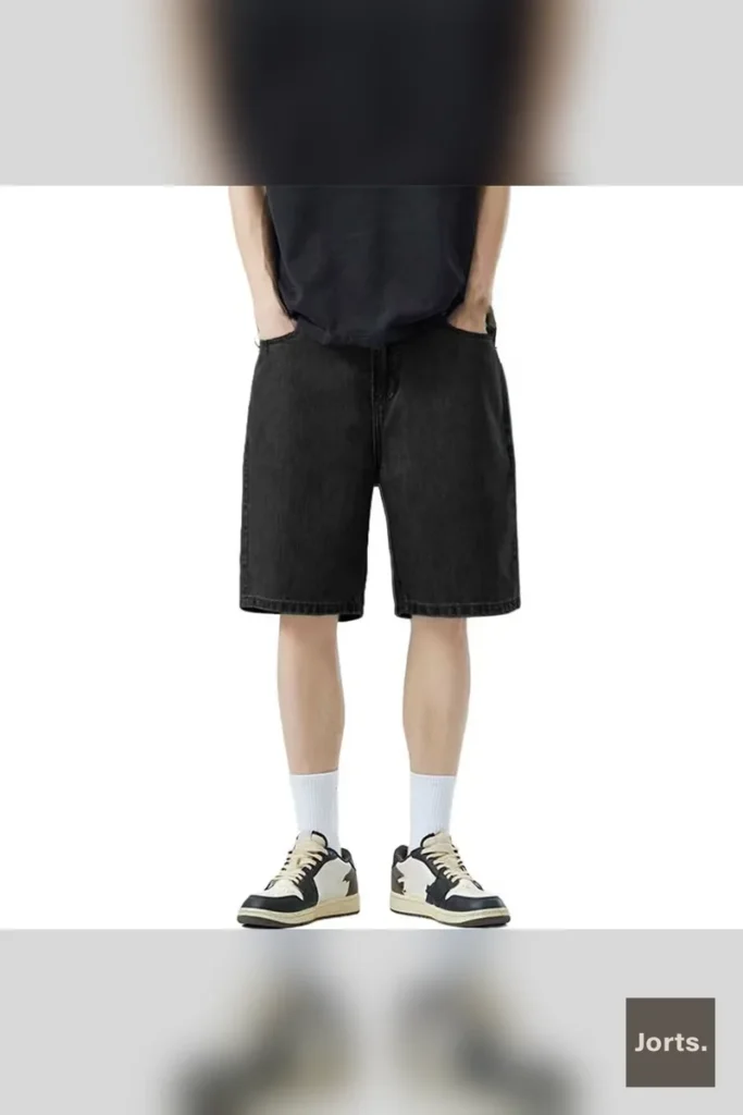 Side view of dark blue Y2K baggy denim shorts with a loose straight leg, perfect for hip-hop inspired streetwear.