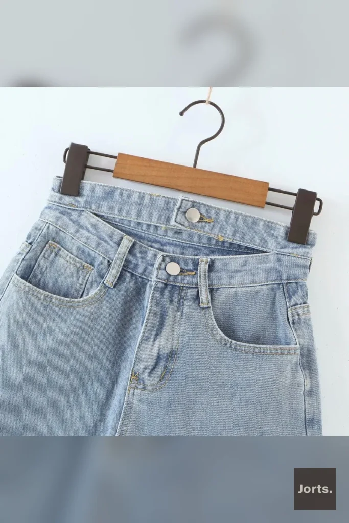 Back view of Y2K Street Double Waist Cut-out Raw Edge Blue Jorts, showing the relaxed silhouette.