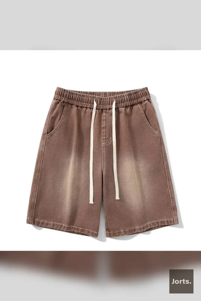 Side profile of black Y2K washed straight-leg jorts, showing relaxed fit