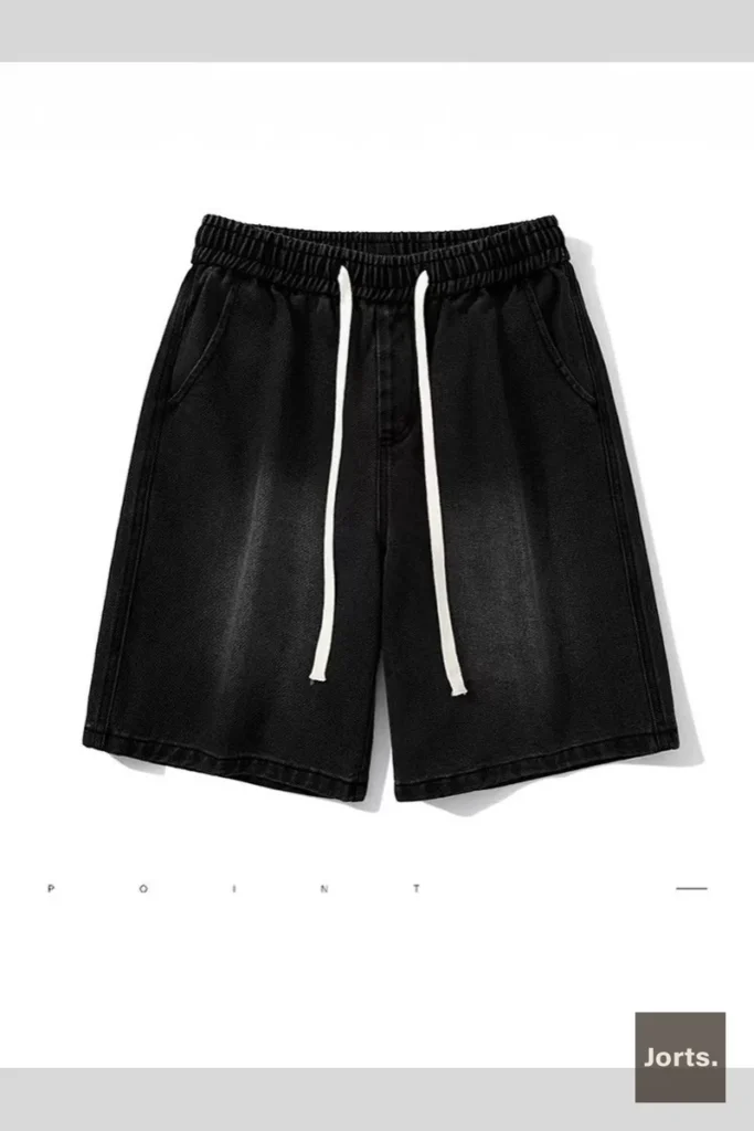 Close-up of grey Y2K washed jorts high waist and zip fly detail