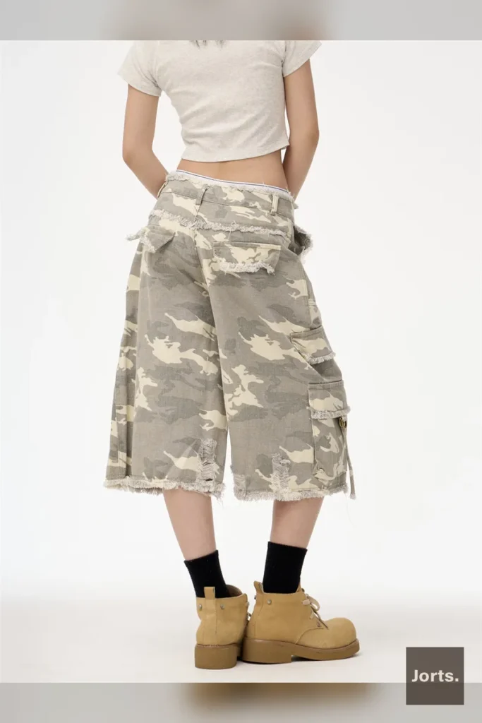 Side view of woman in Y2K camouflage straight leg cropped jorts, showcasing streetwear fit.