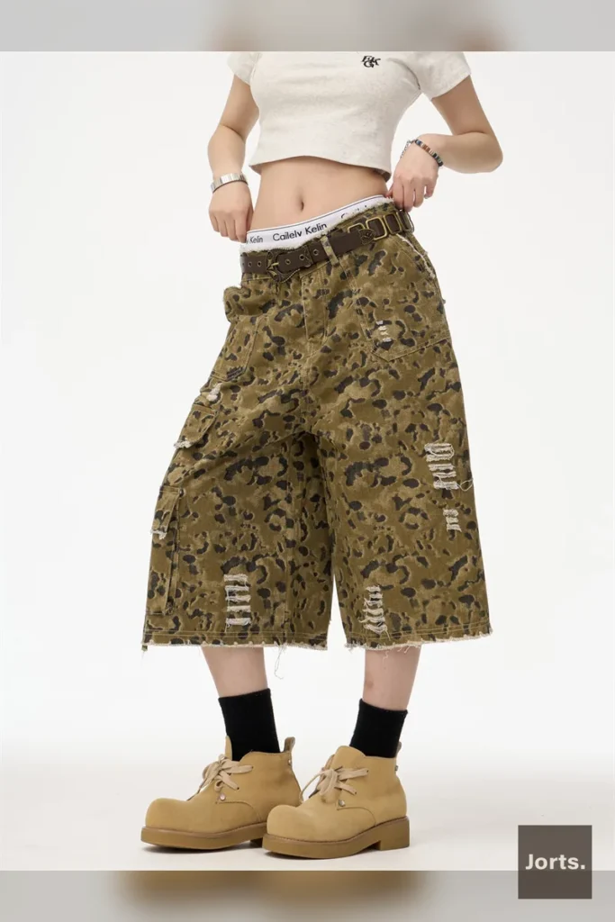Woman wearing Y2K camouflage straight leg cropped jorts with a natural waist, front view.