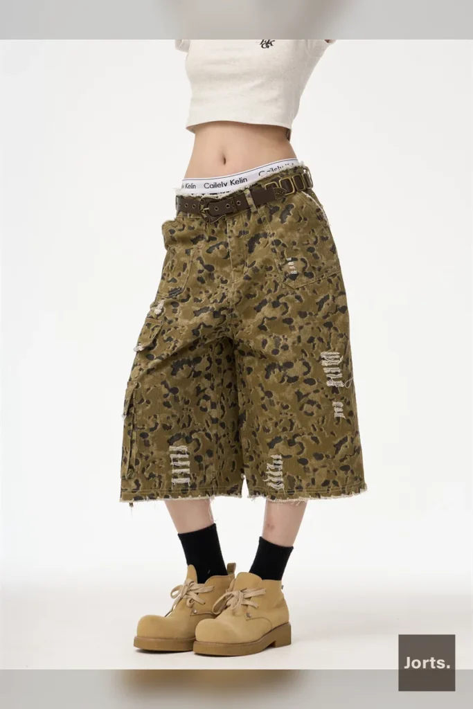 Close-up fabric detail of leopard print women's straight leg cropped jorts.