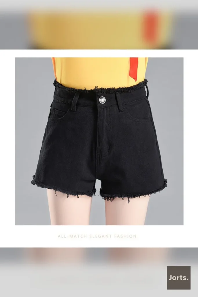Full shot of woman in black Y2K washed denim flare shorts, showcasing wide-leg fit.